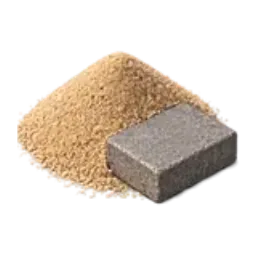 A mound of fine paver sand beside a rectangular paving stone.